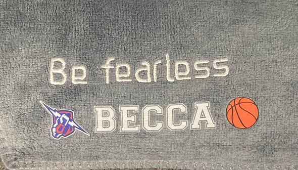 NC Thunder personalized sports towel - embroidered detail showing Be fearless, BECCA, team logo and basketball